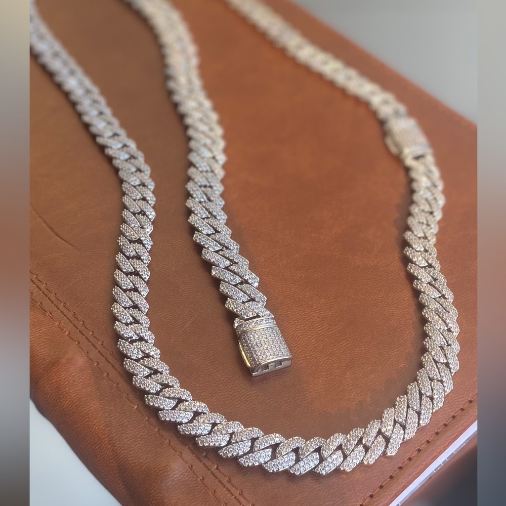 Flooded prong set iced out cuban. 14k WG & rhodium finish. 5A zicron diamond